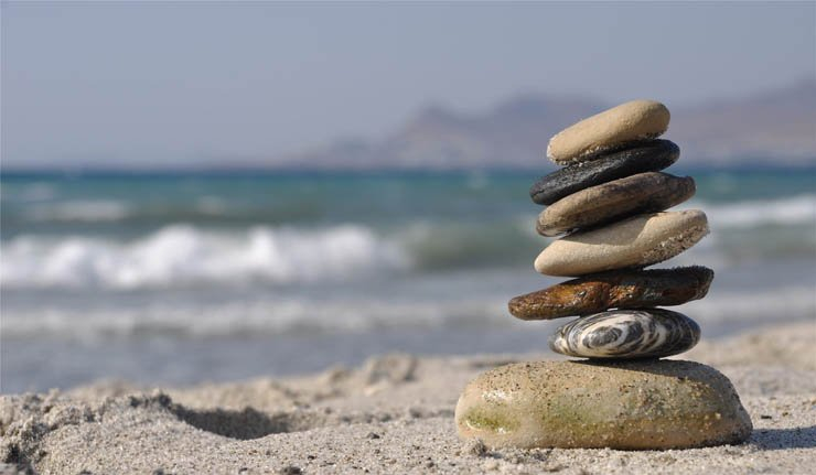 Stacked stones rock rocks stone sand sandy beach sea water ocean