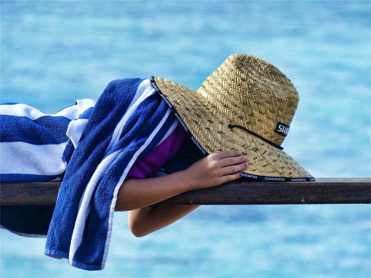 Summer child kid laydown sleep towel hat sea sunny clear