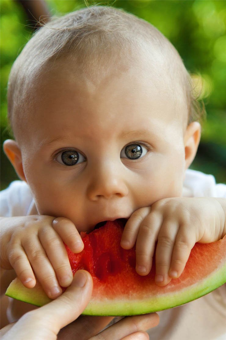 adorable baby eating watermelon