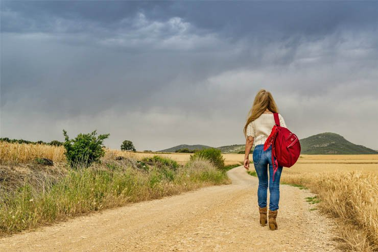 adult girl walking alone passway desert