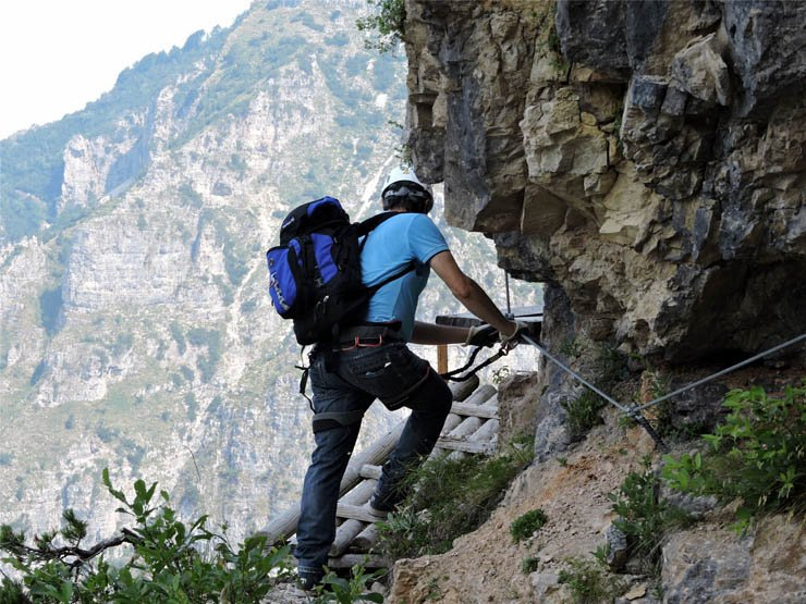 backpack climb climber climbing sport helmet mountain hill nature