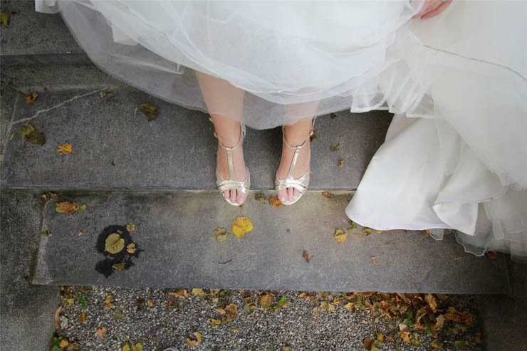 bride shoe white dress stairs leaf leaves feet wedding party happy ceremony