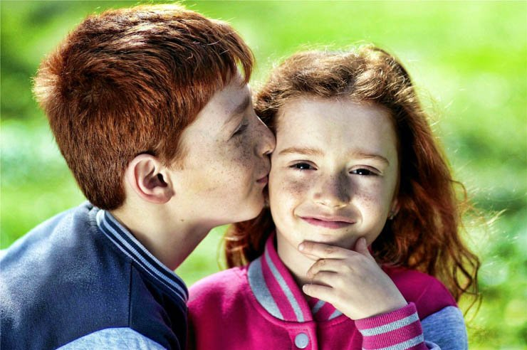 children kids kissing kiss redhead hair sunny nature smile