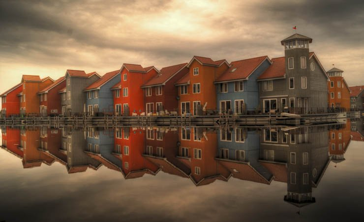 city town country house houses building buildings water lake river sky cloudy colorful color window windows
