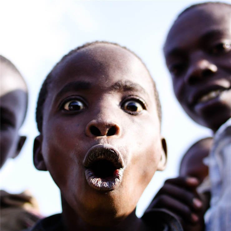 face faces africa african village kid kids boys boy surprised