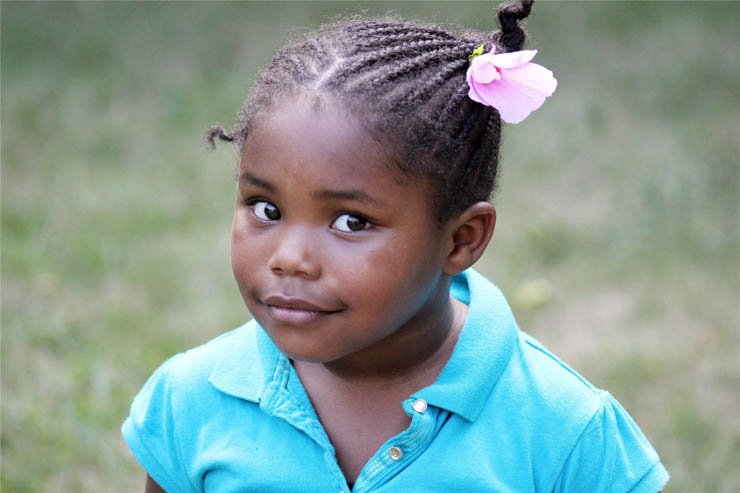 face faces africa african village kid kids flower girl happy smile