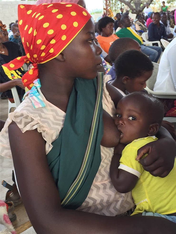 female boy baby breastfeed african africa woman