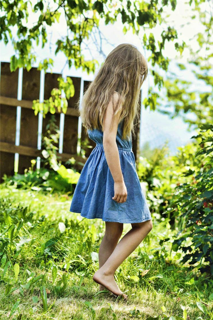 girl kid child dress jeans natural sunny wood wall