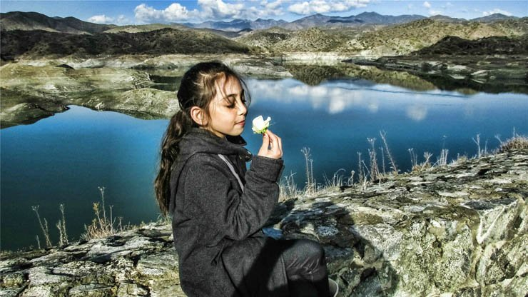 girl kid flower sit sitting sea sky mountains relax nature clear white