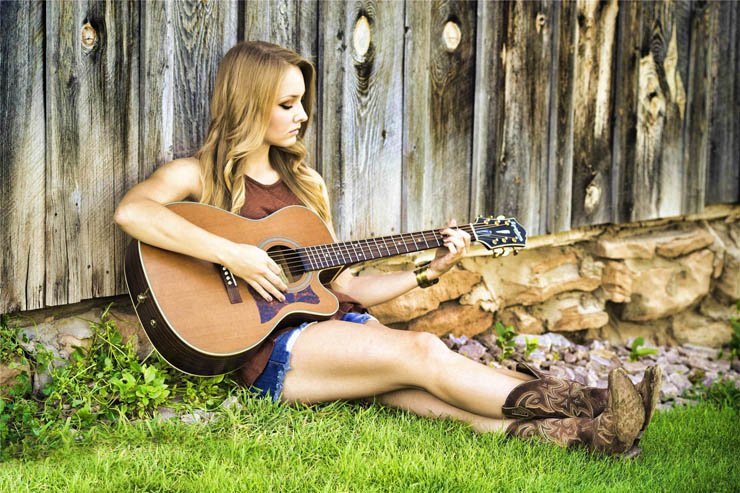 girl playing guitar music country grass