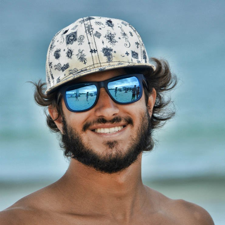 handsome man male boy beach sea vacation hat sun sunglasses glasses smile happy topless beard hair long