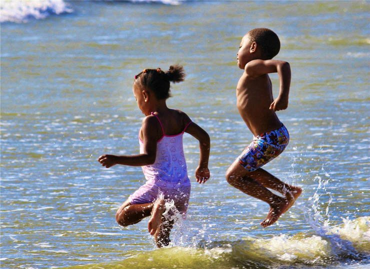 kids african jump jumping sea wave enjoy swimmingsuit