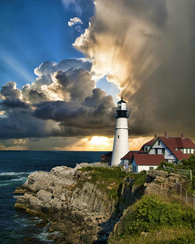 light house lighthouse water island ocean sea mountain sky ray rays sunset