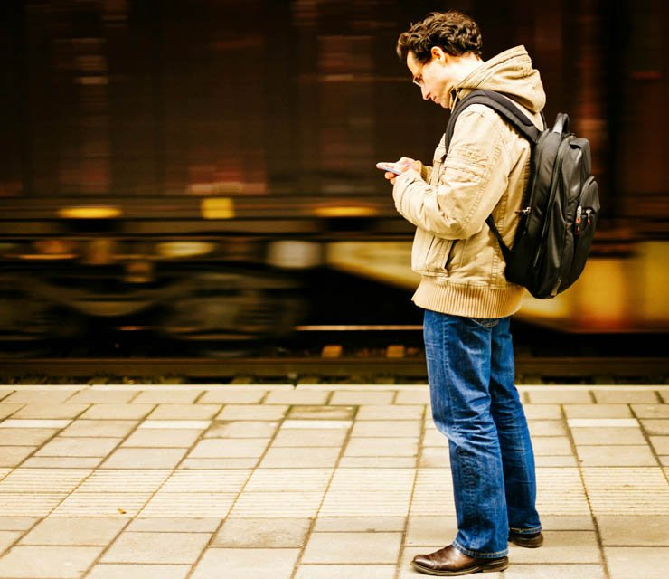 man adult text texting wait waiting platform metro train under ground underground