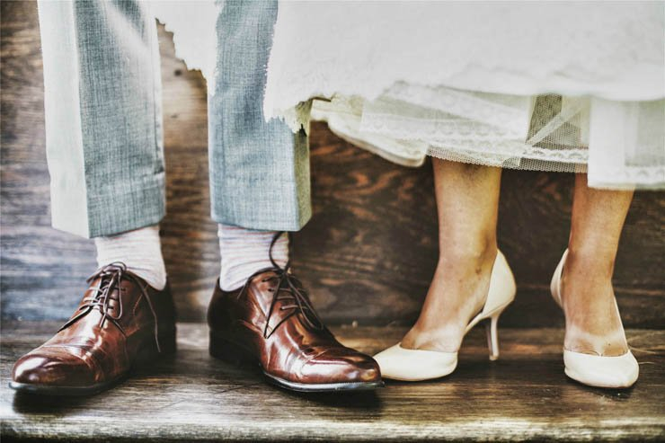 marriage man woman heels dress floor wood wedding