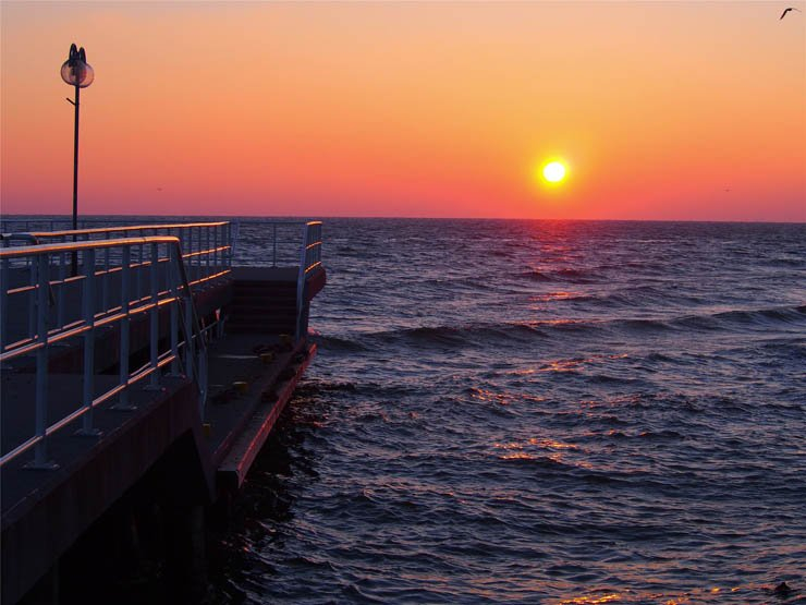 nature natural sky water sea ocean wave waves sun sunset platform evening