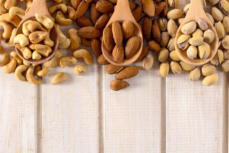 nuts almond food hazelnut wood spoons cashew pistachio snacks