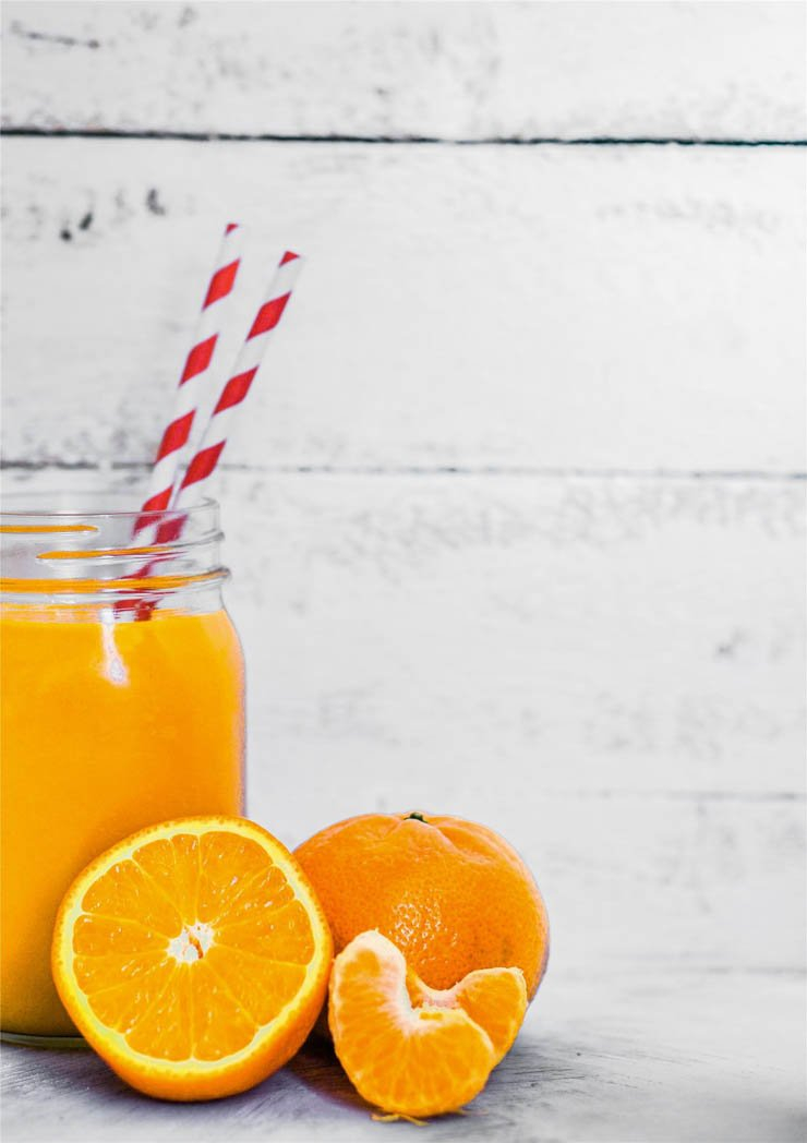 orange juice drink drinks straw tangerine fruit food eat table
