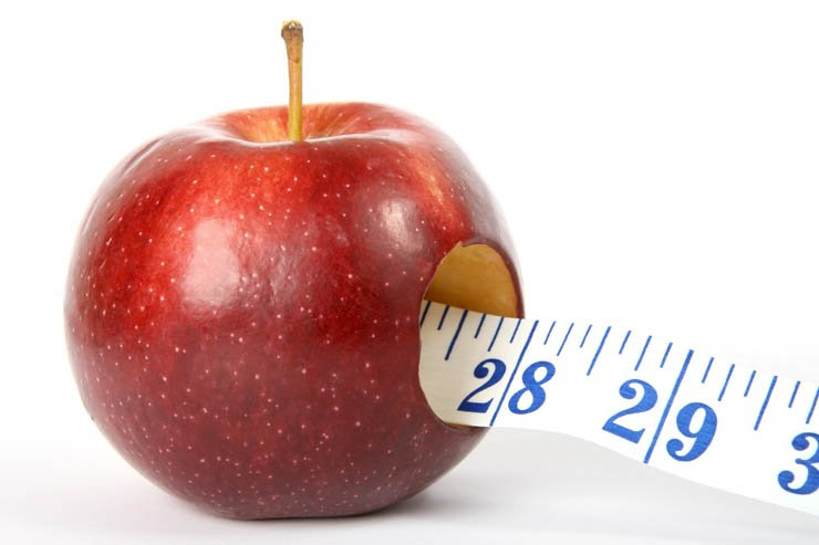 red apple measuring tape inside fruit food weight loss health healthy