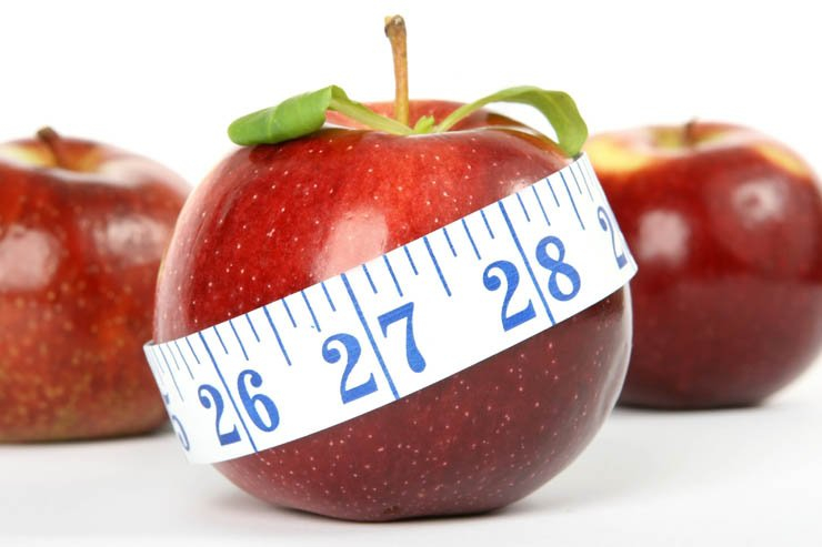 red apples measuring tape fruit food health healthy fruits weight loss diet