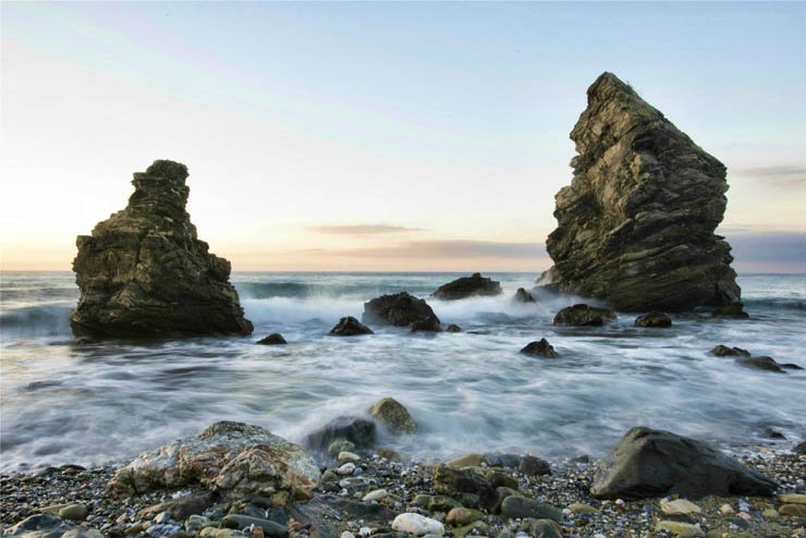 sea ocean rocks stones waves beach shore sky nature sunset