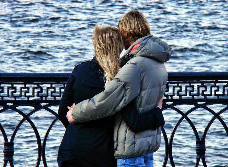 sea river bridge water love couple couples romantic romance love winter man hug woman