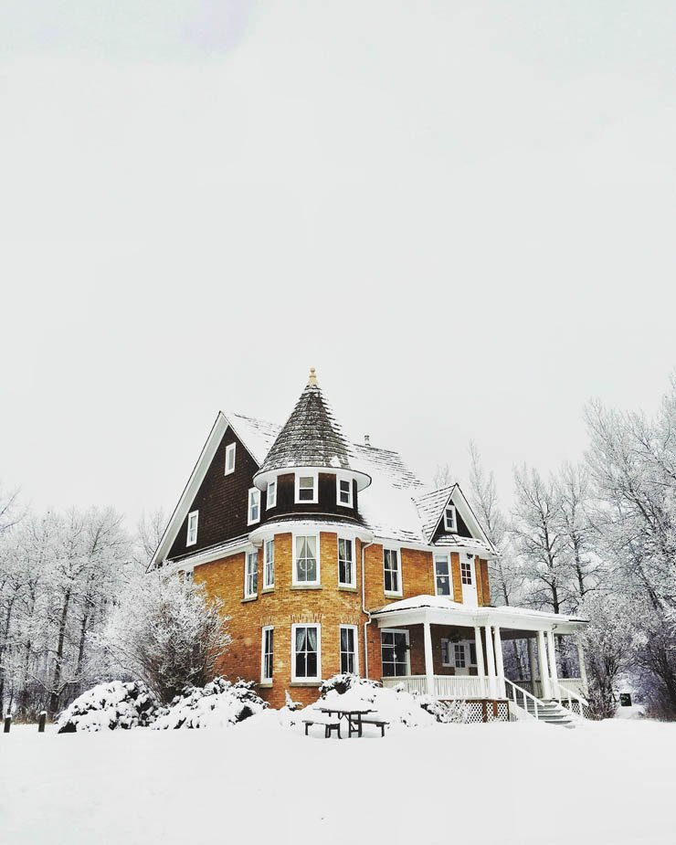 snow house home mansion winter snowy cloudy sky tree cold