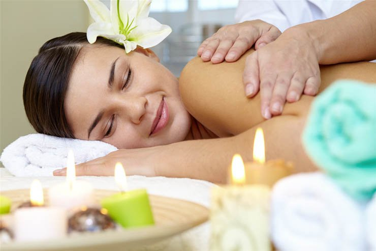 spa massage pretty lady relaxing candles towels flowers
