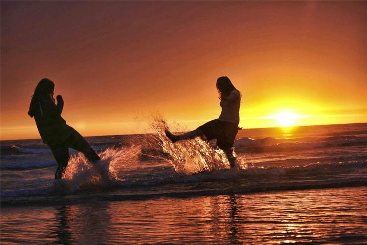 sunset girls fun plaing sea ocean shore beach
