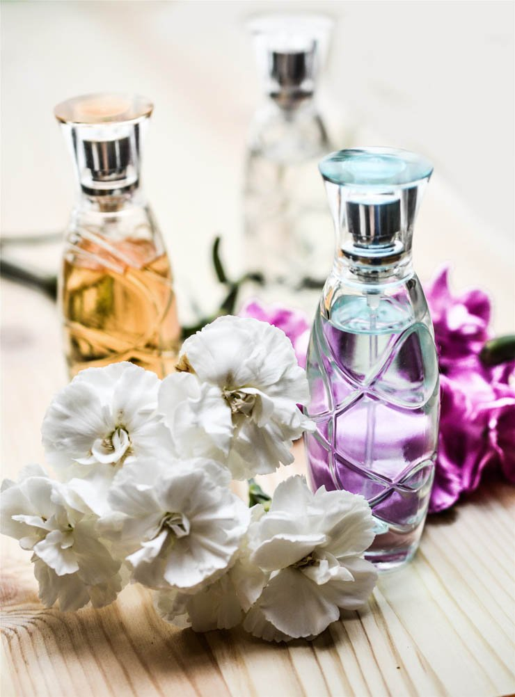 white purple flowers essential oil bottles