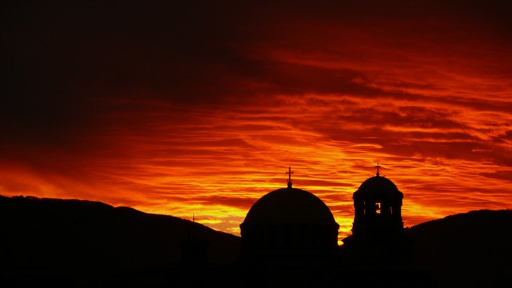 backlit shadow sillhouette church building red sky sunset
