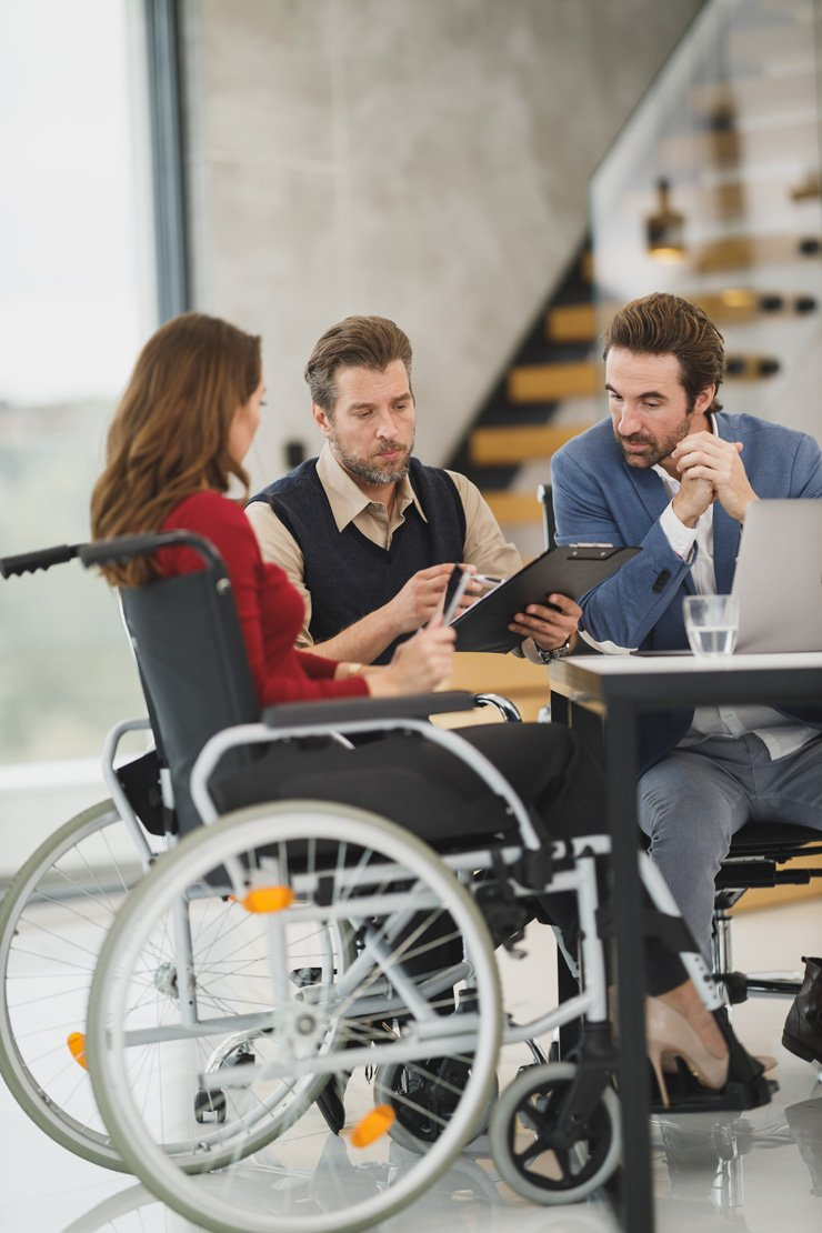 business finance formal job work employee working wheelchair wheel chair meeting discussion colleagues colleague