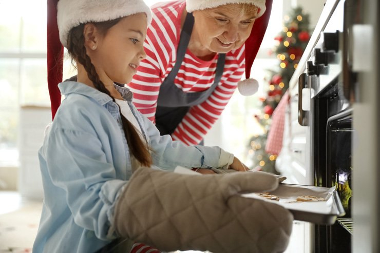 family grandma grandmother baking mom cookie mother bake kitchen cooking christmas xmas holiday cookies daughter sweet oven