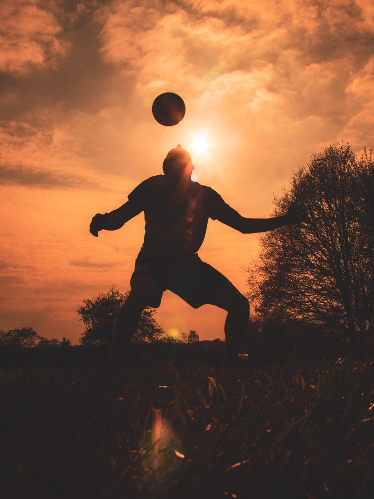 football soccer sport sports play playing header head ball sunset