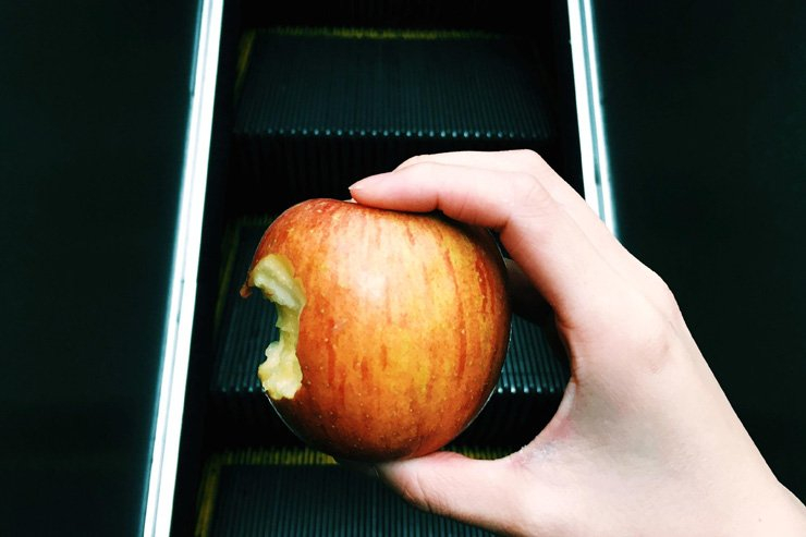fruit fruits food healthy health diet apple bite hold holding escalator