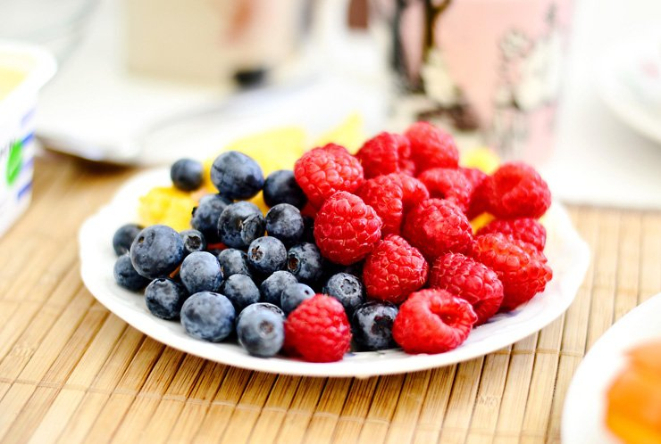 fruit fruits food healthy health diet table bowl blueberry raspberry orange