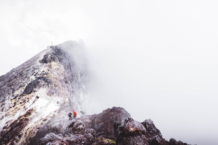 People Climbing the Mountain Top