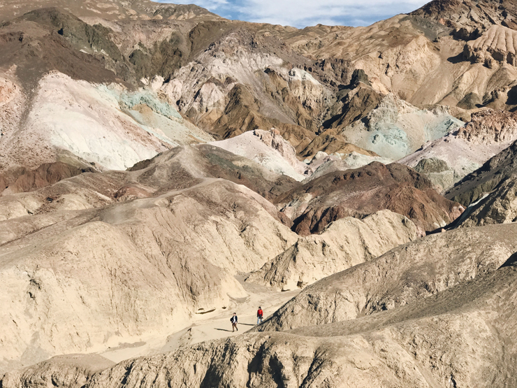 
									People Walking in Desert Rock