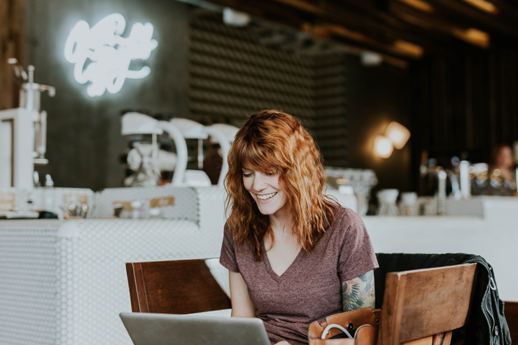 Red Hair Woman Working with Laptop