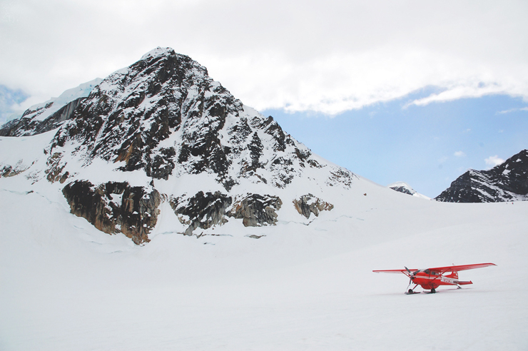 Red Plane on Snow by the Snow Covered Hill