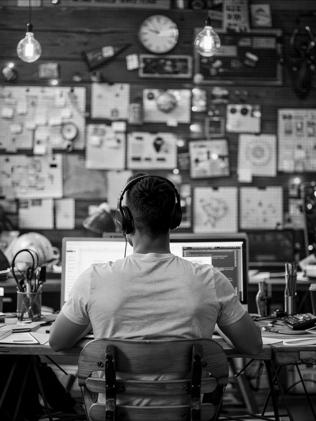 A photo from the back of Osman the founder of PicklesBucket working in his office